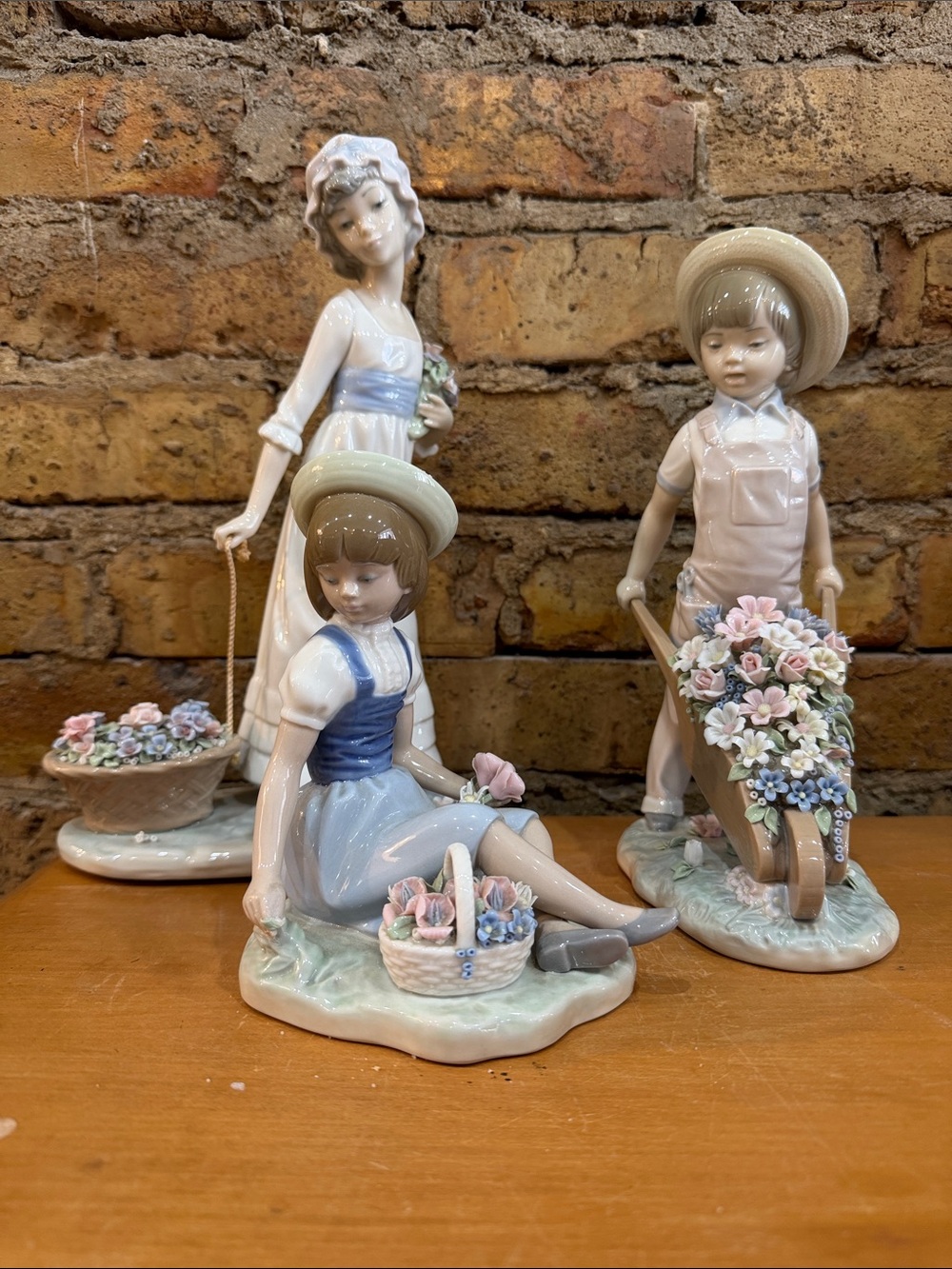 Lladro Pastel Blue and Cream Porcelain Figurine Trio with Floral Accents